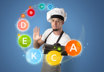 Handsome cook with vitamin concept