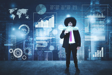 Afro businessman pressing a virtual start button