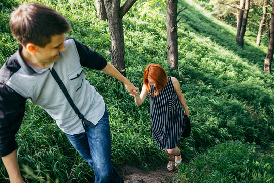 man and woman walking by farest trail