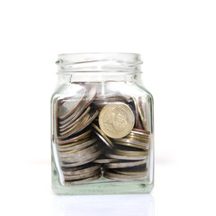 Coins in glass or  Money in glass Isolated on a White Background