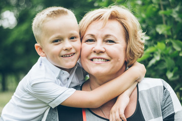 Grandmother playing in the park with grandchildren