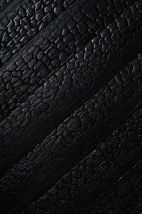 Black burnt wooden texture