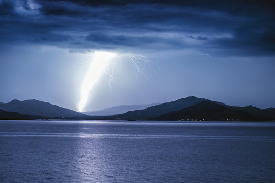 Discharge of lightning on a mountain lake, Bukhtarma Reservoir, Eastern Kazakhstan
