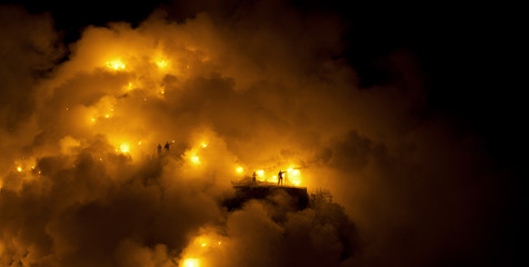 Football fans raising flares