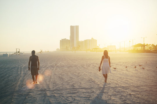 Couple walking on beach 