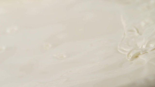 Pouring Milk closeup. Milk Splesh Slow Motion.