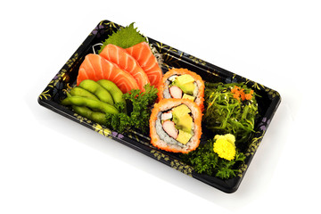Salmon Sashimi and California Maki  fill with Pigeon pea and spicy Seaweed salad Japanese tradition food in delivery low cost box set