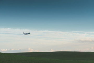 Airplane landing at dusk