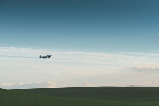 Airplane landing at dusk