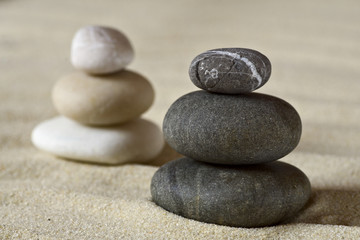 Dark and white piles of balanced stones