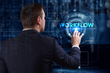 Business, Technology, Internet and network concept. Young businessman working on a virtual screen of the future and sees the inscription: Workflow