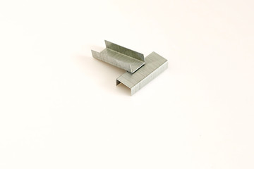 Staples on white background
