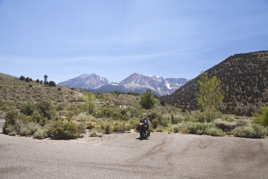 motorcycle parked on side of the road with Yosemite National Park in the background