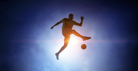 Obraz na płótnie Canvas Soccer player with ball outdoors