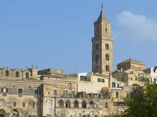 Ancient Architecture of Sicilian mountain village fortress with the dense houses. Panoramic view of the  borough with the church with the bell tower, houses, windows, arches, terraces