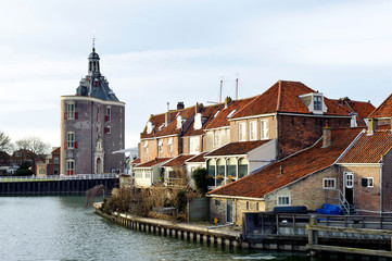 Beautiful view on castle and old houses near the river in Enkhuizen city of Netherlands