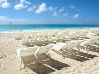 Sunchairs on tropical island