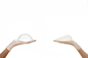 Two different Silicone breast implant on hands