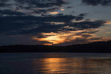 Sunset over the lake and forest