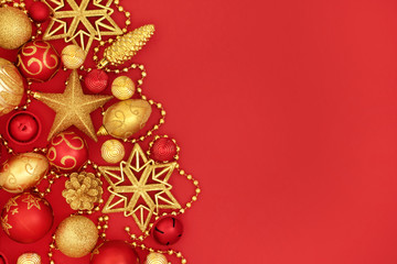 Christmas background border with red and gold bauble decorations.