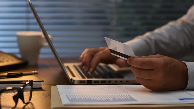 Businessman using a credit card online