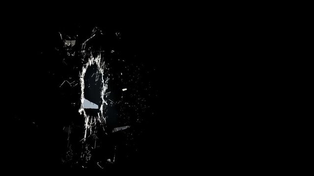 Bullet shattering glass in slow motion