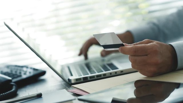 Businessman paying online with a credit card
