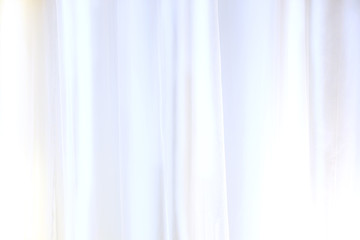 Fototapeta premium White Curtain Or Drapes For Background, Used For Montage Product Display Or Design Visual Layout, Transparent White Curtain Waving On The Background, Beautiful Horizontal Wallpaper With Copyspace