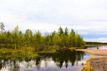 Fototapeta na wymiar Evening landscape with a lake (Kola Peninsula, North of Russia)