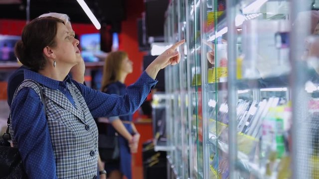 shoppers at an electronics store