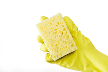 hand in rubber yellow glove holding sponge on white background. cleaning