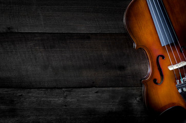 The violin on the table, Close up of violin on the wooden floor, Top view of violin musical on dark...