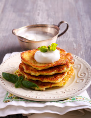 Zucchini and feta fritters with sour cream