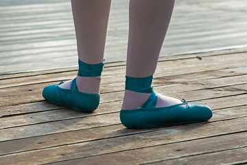 Blue ballet shoes with white socks in ballerina.