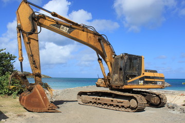 caraïbes canouan mer plage tractopelle