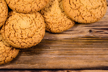 Stack of the oatmeal cookies on wooden table