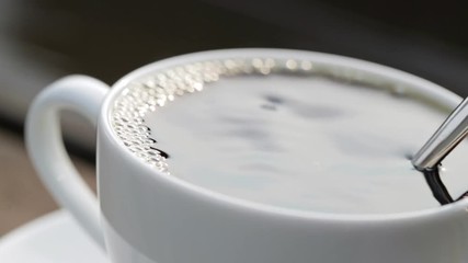 Stirring the coffee with slow motion