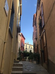 Small colorful alley in a town, south of France