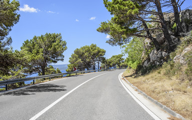Fototapeta na wymiar Country road for cars along the sea coast.