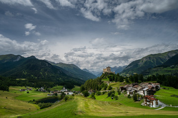 Fototapeta na wymiar panorama view of the beautiful alpine village of Tarasp and the lower Engadin Valley in the Alps in Switzerland