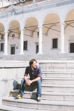 Lazy man sitting on the Stairs Outdoor
