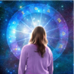 young woman standing in front of an astrology wheel with zodiac signs and stars background