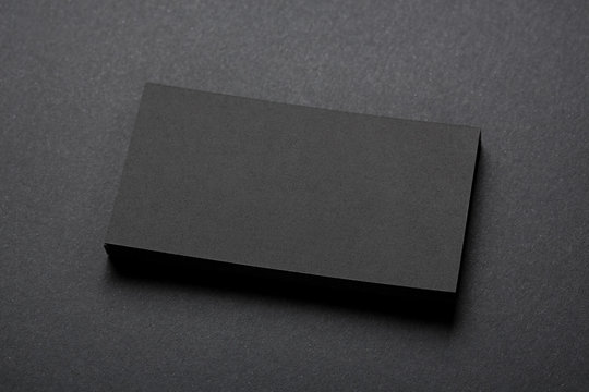blank business cards on black background