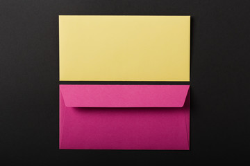 two envelopes on black background