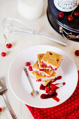Cake, dessert and pastries, biscuit pie with cherry, raspberries and milk on a light background 