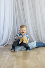 Fototapeta premium Happy little boy. Funny little boy play at home