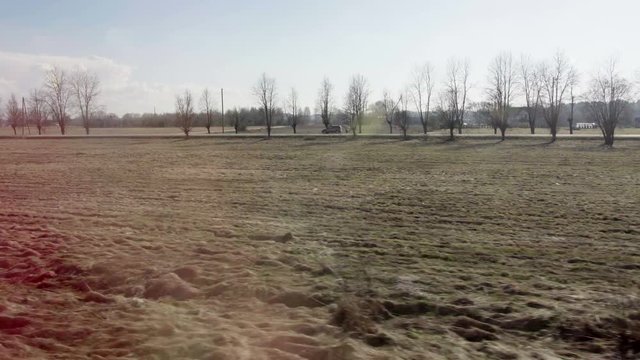 View of passing landscape from a train window 4k