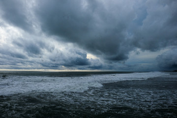 Naklejka na ściany i meble tropical sea storm coming at Glagah beach
