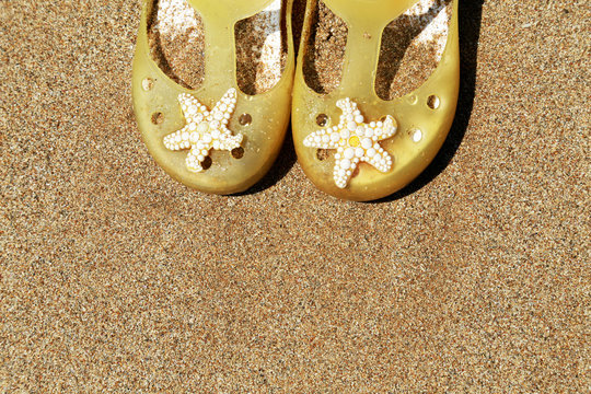 slippers on the beach