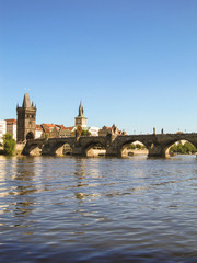 A view of Charles Bridge in Prague in a sunny afternoon